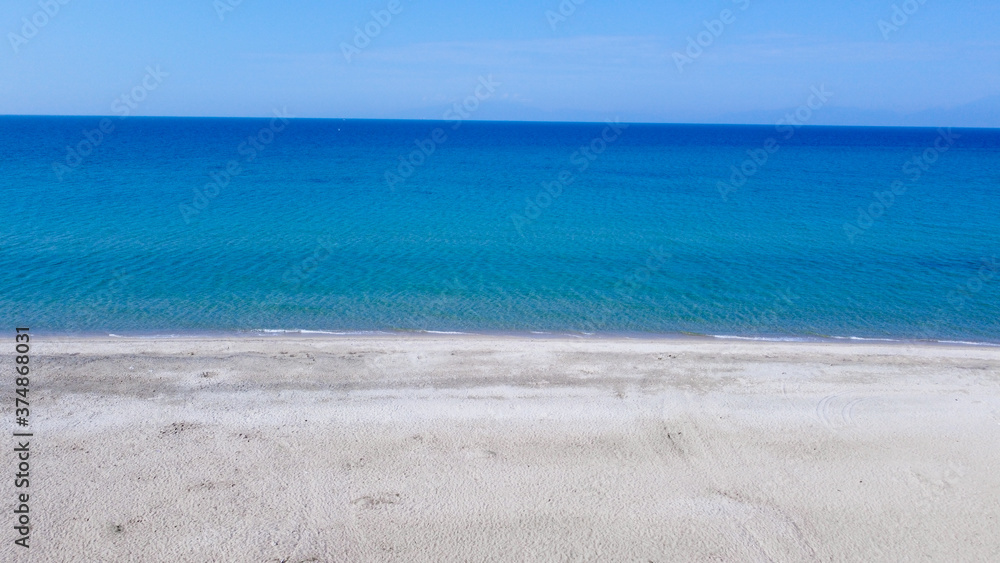 Aerial view of empty tropic sand beach and blue sea 
