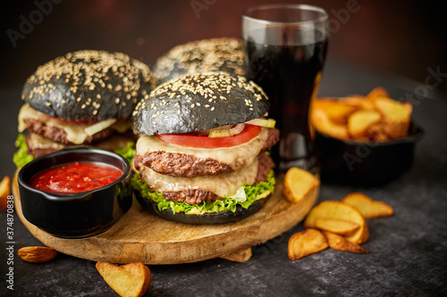 Delicious black hamburger with patties and cheese