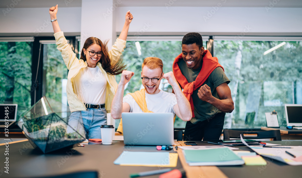 © BullRun - Happy multiethnic coworkers celebrating project finishing © BullRun - Happy multiethnic coworkers celebrating project finishing
