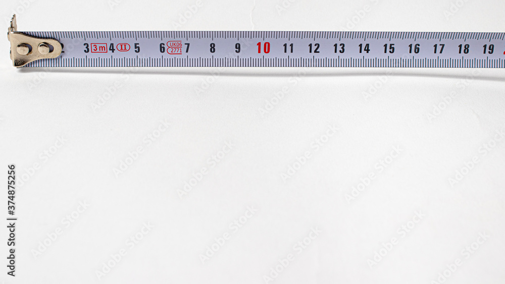 Measuring tape with numbers centimeters on a white background. Construction tools. Banner with place for text Measuring tape with numbers centimeters on a white background. Construction tools. Banner with place for text