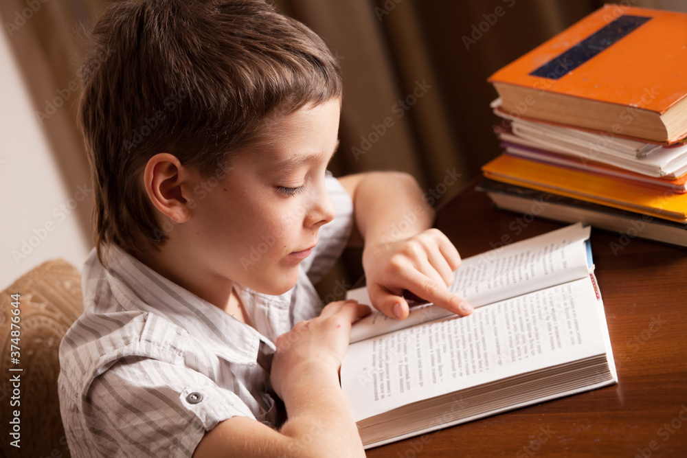 Boy reading book Boy reading book
