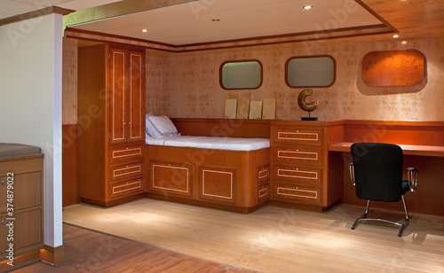 Interiors of a yacht. Walls and furniture. Wooden panels.Ship building industry. Shipyard. Building superyachts. photo