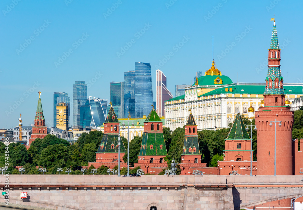 Towers of Moscow Kremlin and Grand palace with International Business Center (Moscow City) at background, Russia
