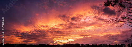 Colorful and dramatic sky panorama of sunset background