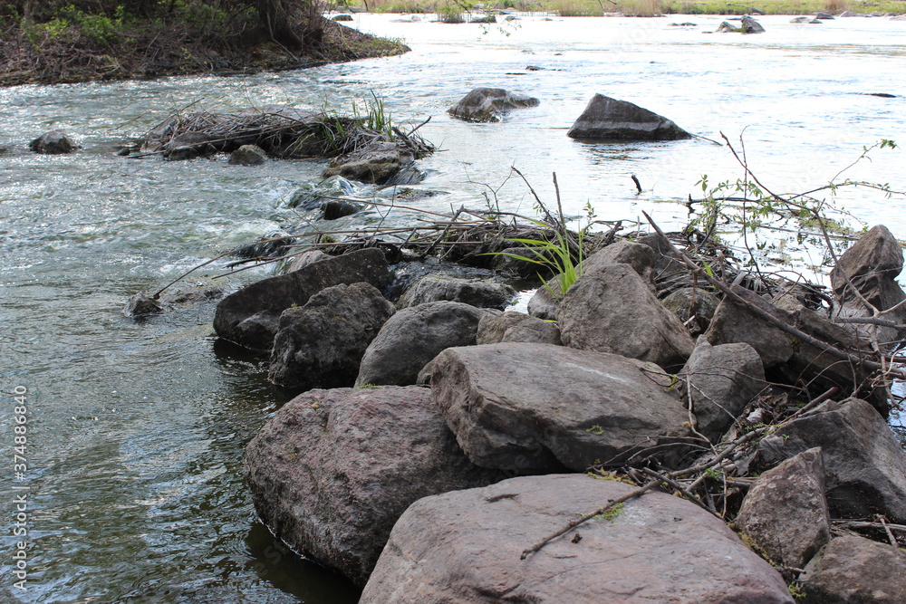 River with large granite stones. Steppe. Nature