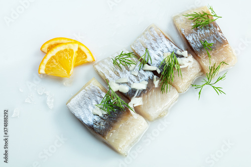 fillet herring serving with lemon on white background