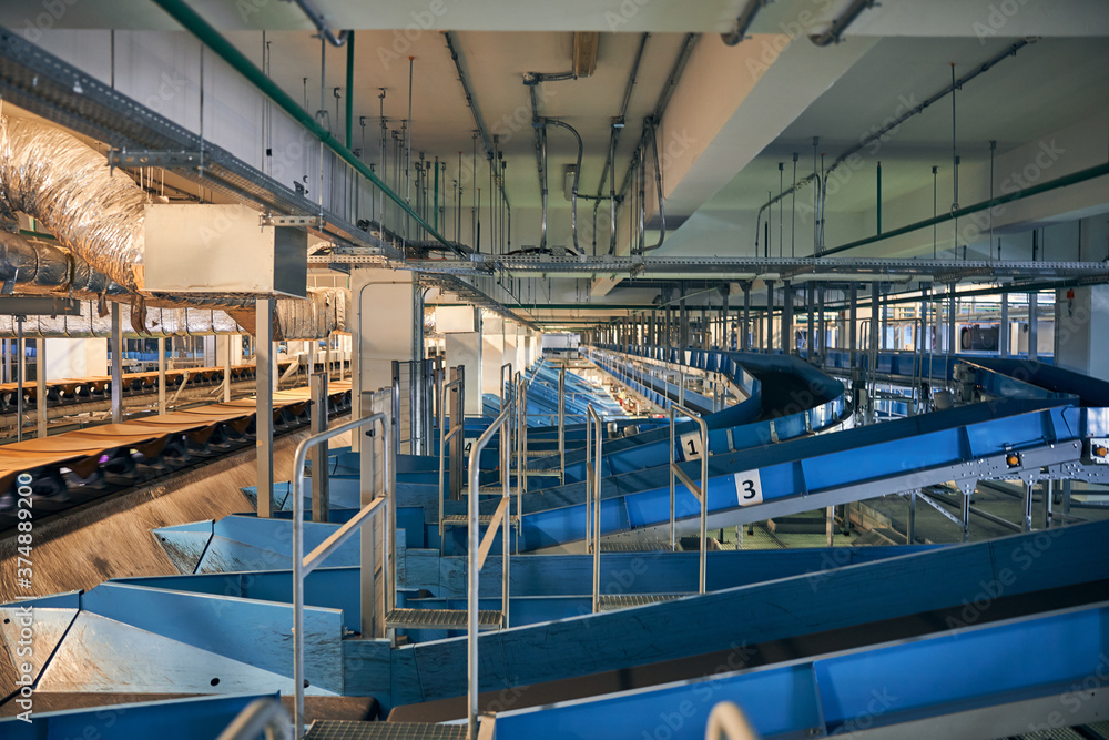 Photo of baggage sorting stations with conveyor belts