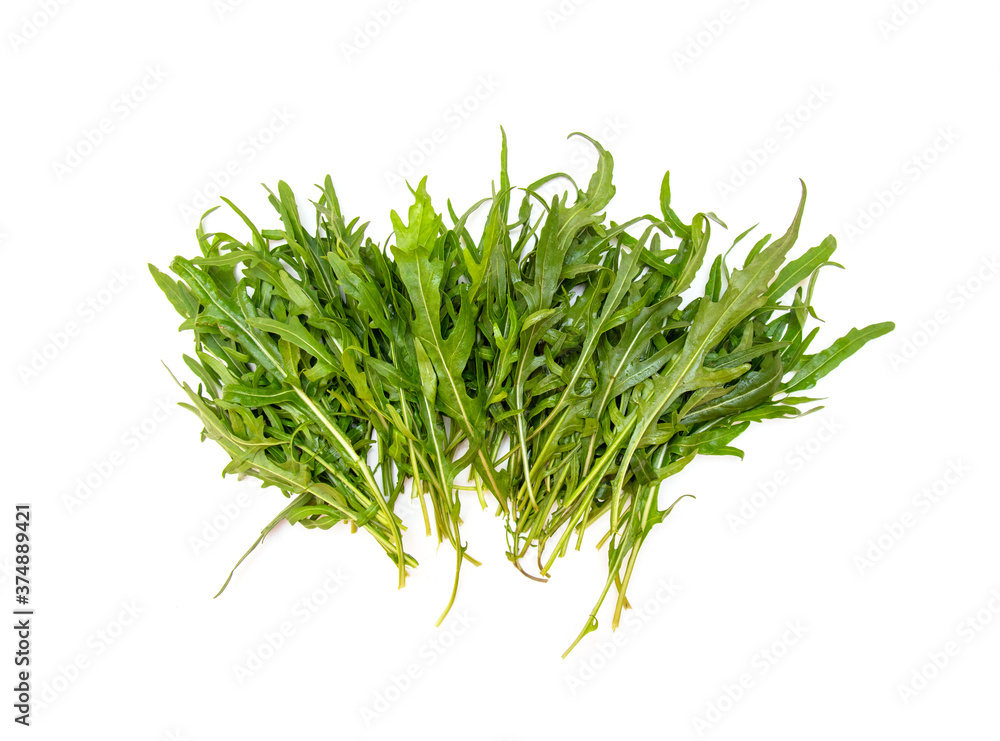 Green arugula leaves on white table Green arugula leaves on white table