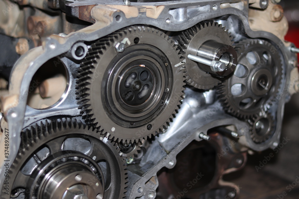 The mechanic is checking the engine. The mechanic is checking the engine.