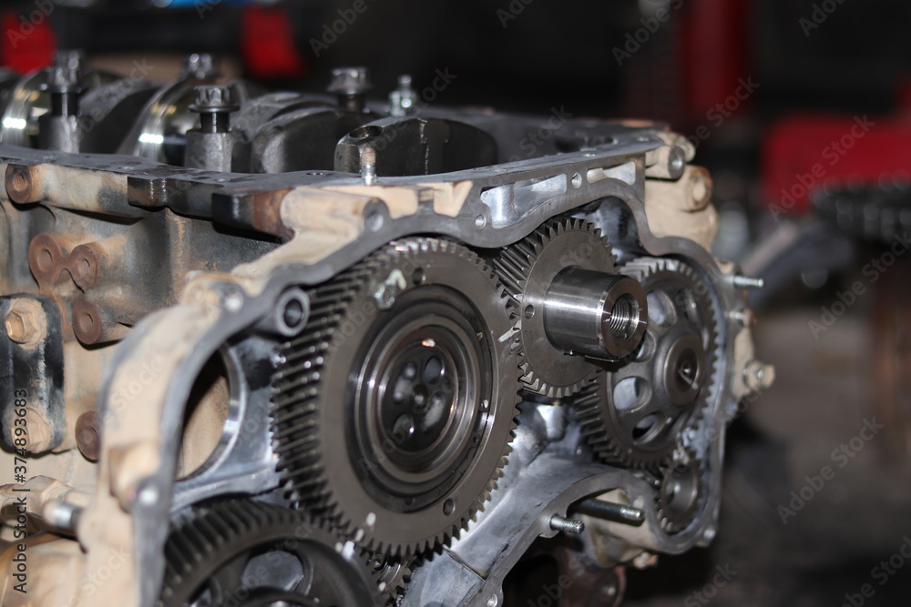 The mechanic is checking the engine. The mechanic is checking the engine.