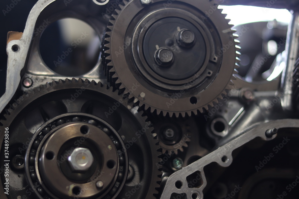 The mechanic is checking the engine. The mechanic is checking the engine.