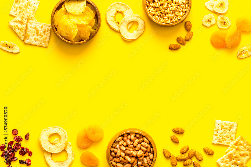 Frame of nuts overhead with dried fruits and other snacks top view Frame of nuts overhead with dried fruits and other snacks top view