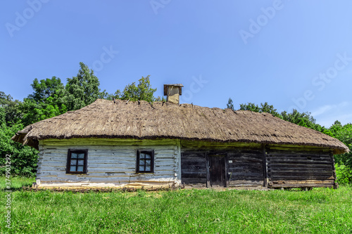 Wooden old house in meadow
