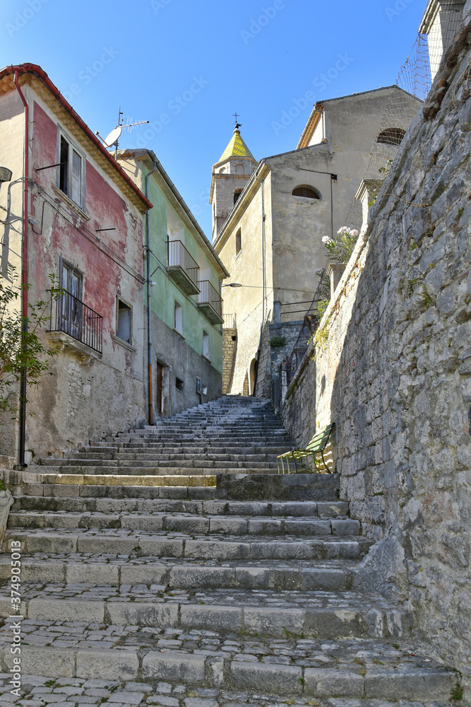 A narrow street among the old houses of Sepino, a medieval village in the Molise region.