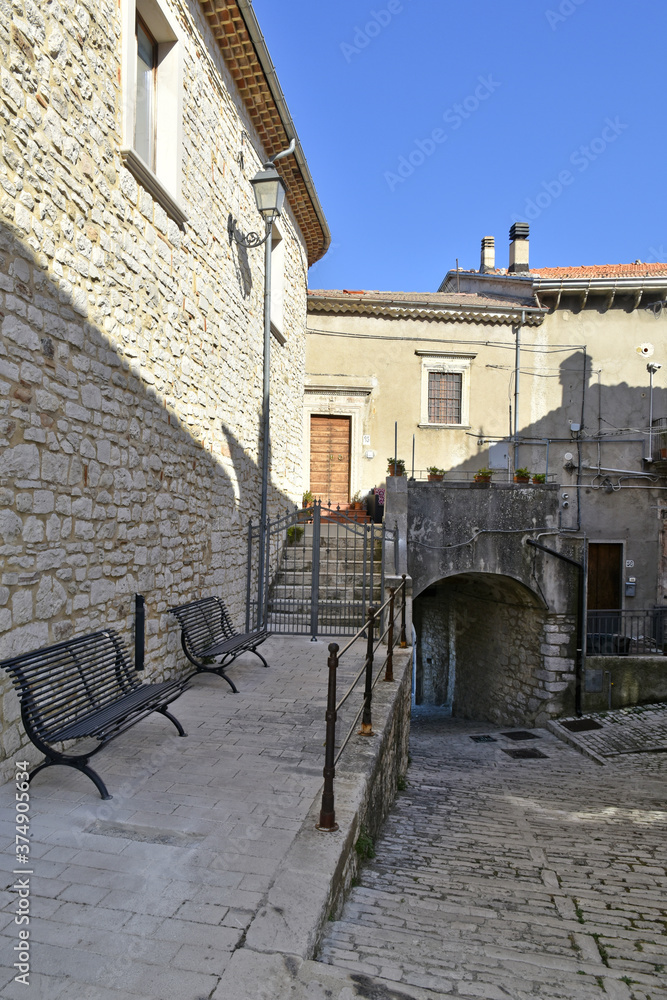 Fototapeta premium A narrow street among the old houses of Sepino, a medieval village in the Molise region.