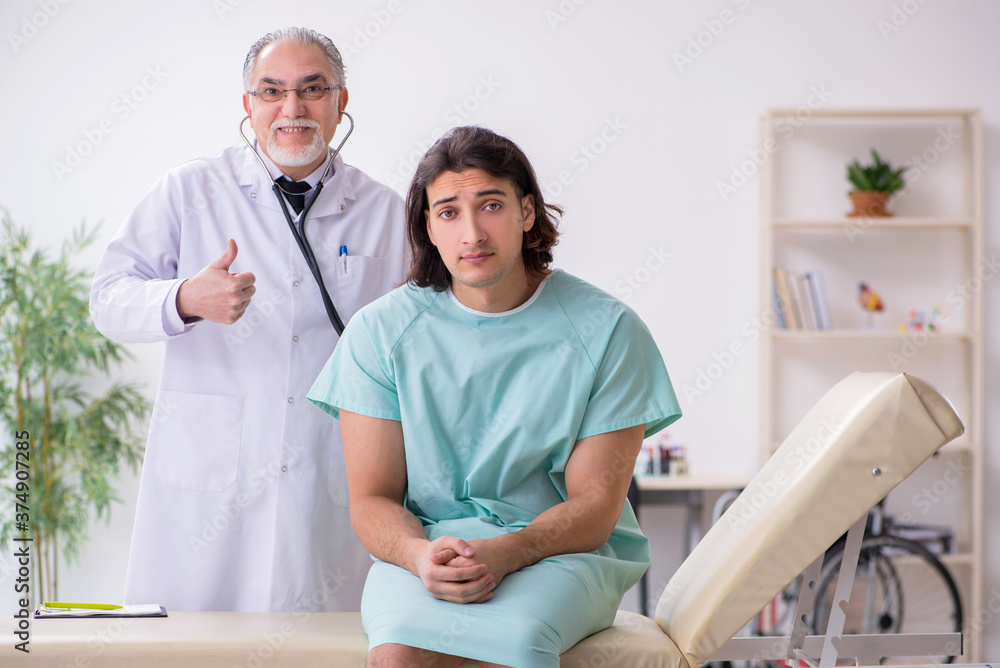 Fototapeta premium Young male patient visiting experienced doctor