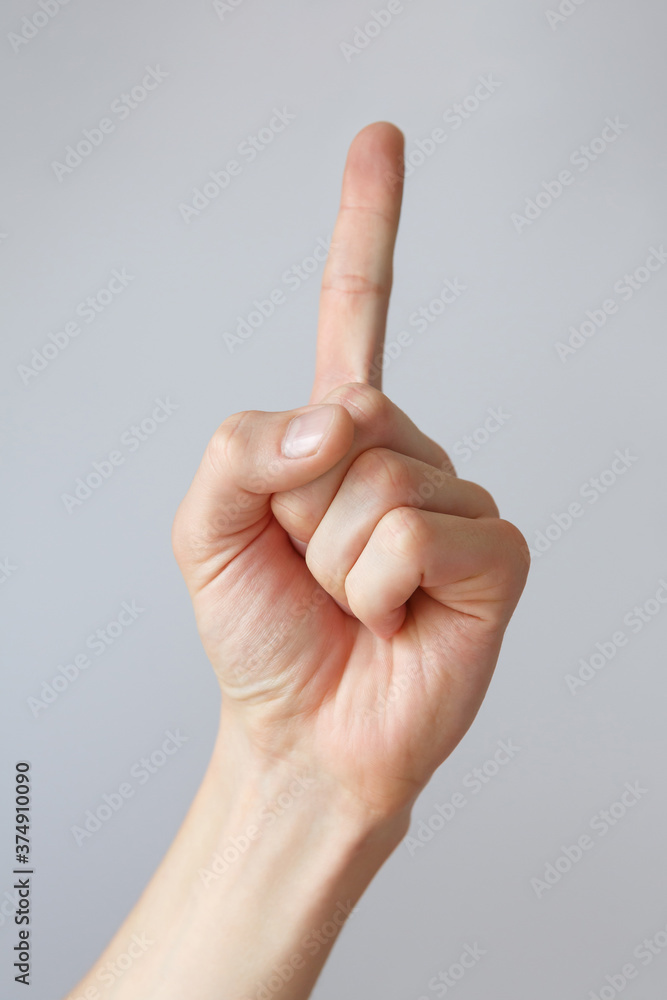 Man hand shows the number one. Countdown gesture or sign. Sign language. Man hand shows the number one. Countdown gesture or sign. Sign language.