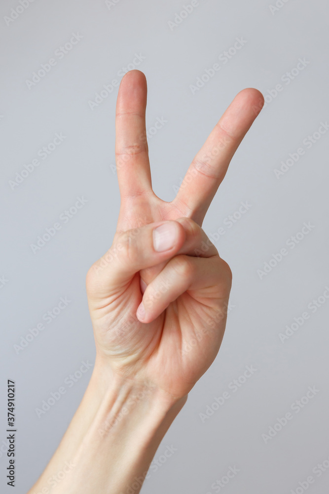 Man hand shows the number two. Countdown gesture or sign. Sign language. Man hand shows the number two. Countdown gesture or sign. Sign language.