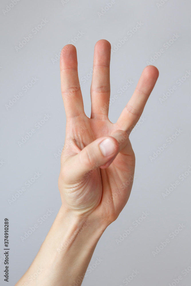 Man hand shows the number three. Countdown gesture or sign. Sign language. Man hand shows the number three. Countdown gesture or sign. Sign language.