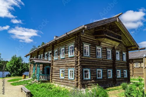 Wooden old house in meadow