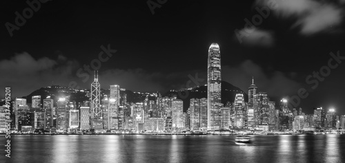 Panorama of night scenery of Victoria Harbor in Hong Kong city © leeyiutung