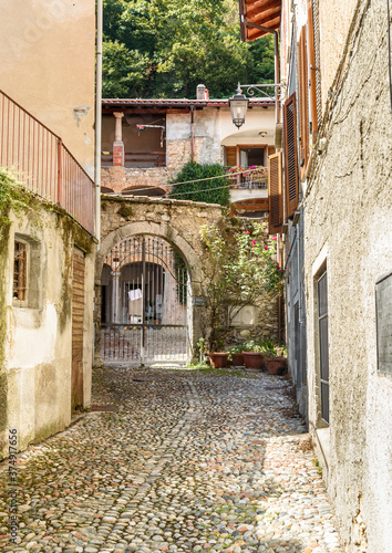 The narrow streets in ancient village Castello Cabiaglio in the province of Varese, Lombardy, Italy. photo