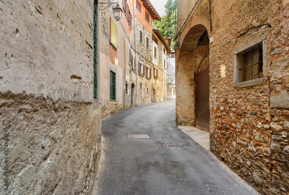 The narrow streets in ancient village Castello Cabiaglio in the province of Varese, Lombardy, Italy.