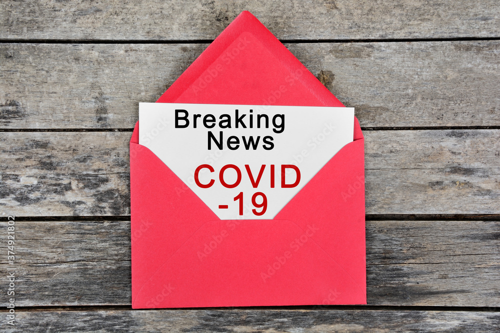 Breaking news Covid-19 words on paper Breaking news Covid-19 words on paper