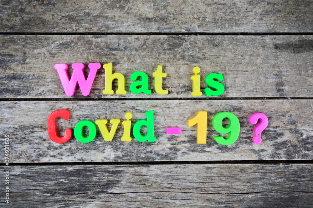 Fototapeta premium Question What is covid-19 on a wooden table