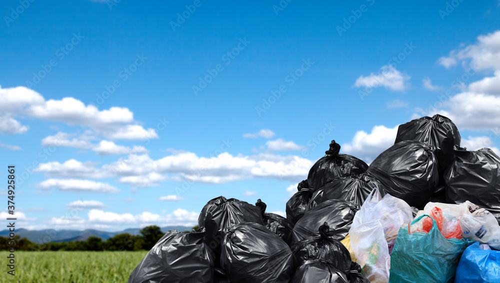 garbage bags large pile, plastic garbage waste big stack, lot of waste bag  and sky background, copy space Stock Photo | Adobe Stock