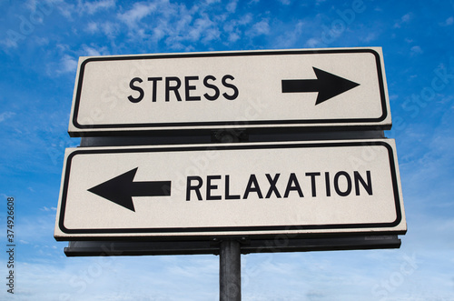 Stress vs relaxation. White two street signs with arrow on metal pole with word. Directional road. Crossroads Road Sign, Two Arrow. Blue sky background. Two way road sign with text.