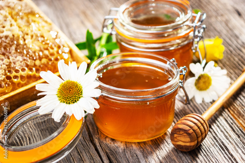 jar of honey with flowers