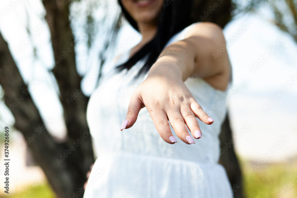 girl shows her beautiful pink manicure in the nature. girl shows her beautiful pink manicure in the nature.