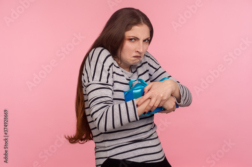 Slika na platnu My precious! Portrait of funny selfish avaricious woman embracing gift box and looking with greedy jealousy expression, don't want to share present