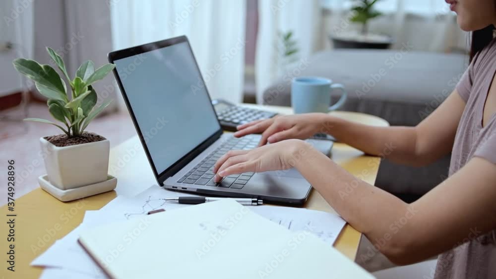 woman busy typing keyboard on laptop at home. Working at home concept. woman busy typing keyboard on laptop at home. Working at home concept.