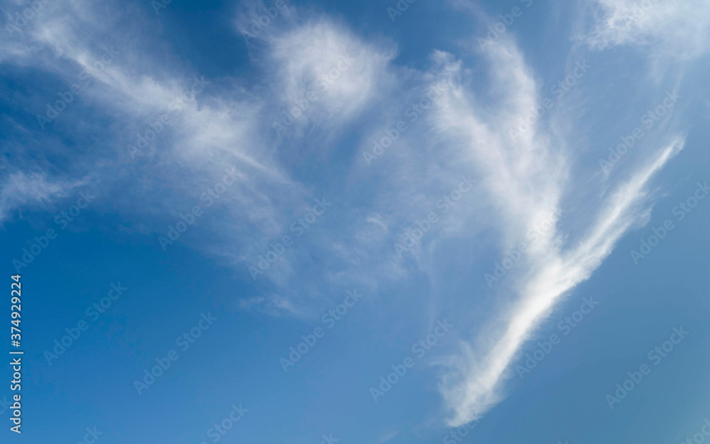 Beautiful Blue sky in summer. Clouds on a nice day being blown by the wind Beautiful Blue sky in summer. Clouds on a nice day being blown by the wind