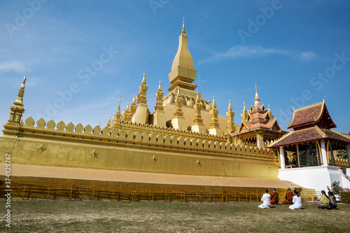 Pilgrims praying at the great stupa in Vientiane  Laos.