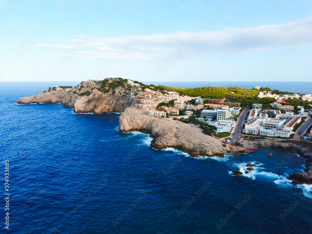 Aerial view of touristic apartments and hotels in Cala Agulla in Majorca, Spain