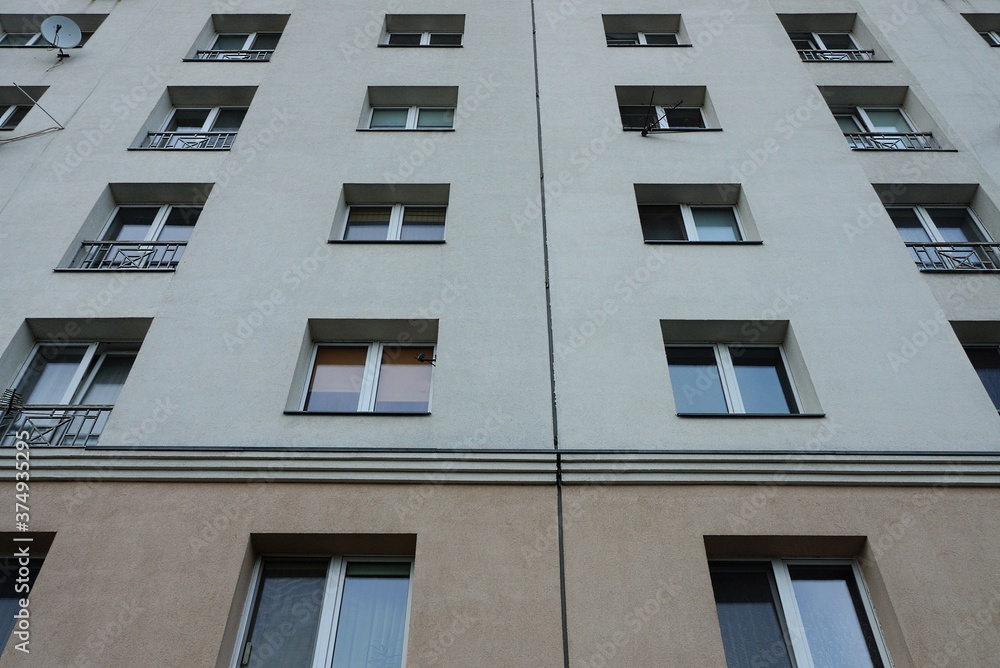 texture of a row of windows on a gray wall of a house texture of a row of windows on a gray wall of a house
