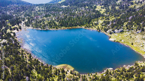 Beautiful Blue Lake of Malniu, Catalan Pyrenees Mountains, Spain.