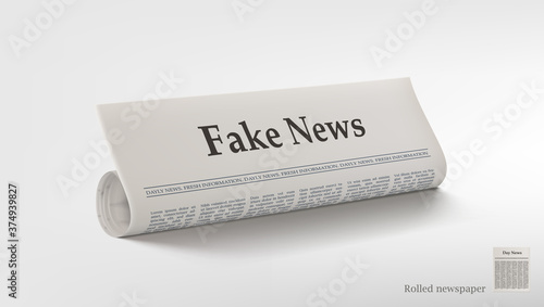 Rolled Newspaper With Big Title Fake News