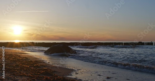 Wallpaper Mural Beautiful sunset at beach with small waves, 4k Torontodigital.ca