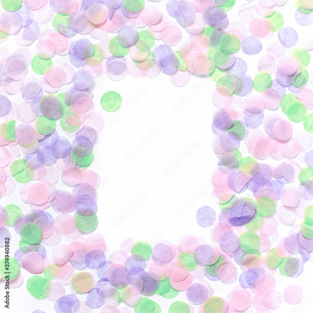 An empty rectangular frame made of multi-colored round confetti is on a white background. Festive background. Flat lay, top view, copy space. Mock up. An empty rectangular frame made of multi-colored round confetti is on a white background. Festive background. Flat lay, top view, copy space. Mock up.