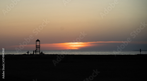 a beautiful summer sunset in the beach of is arutas, west sardinia