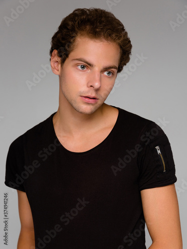 Wallpaper Mural Hipster handsome male model wearing black blank t-shirt with space for your logo or design in casual urban style Torontodigital.ca