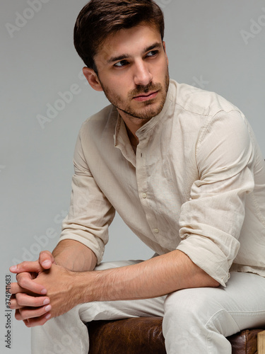 Handsome man wear white shirt and posing in studio