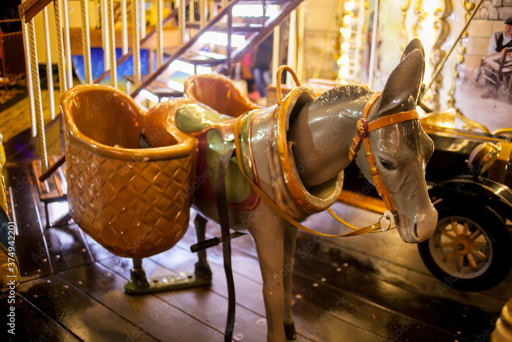 Children's Carousel at an amusement park in the evening and night