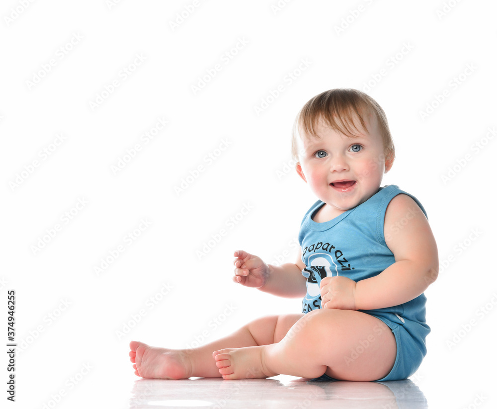 Happy baby boy sitting and laughing Happy baby boy sitting and laughing
