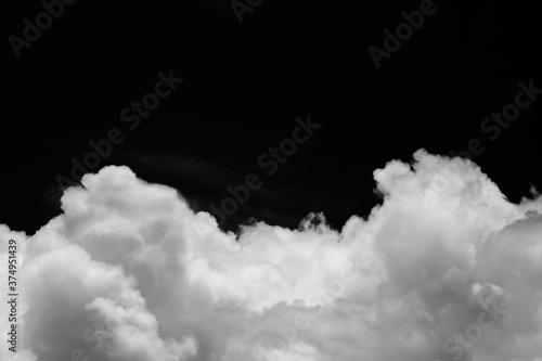 Isolated clouds over black.