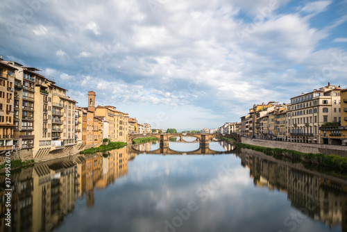 FLORENCE / ITALY - MAY 6 2017: Santa Trinita bridge reflected in the Arno river seen from Ponte Vecchio. © Marcos